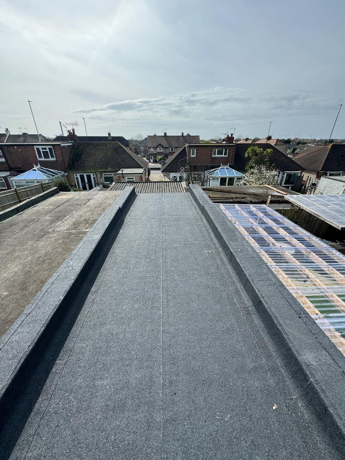 Long felt flat roof overlooking the town