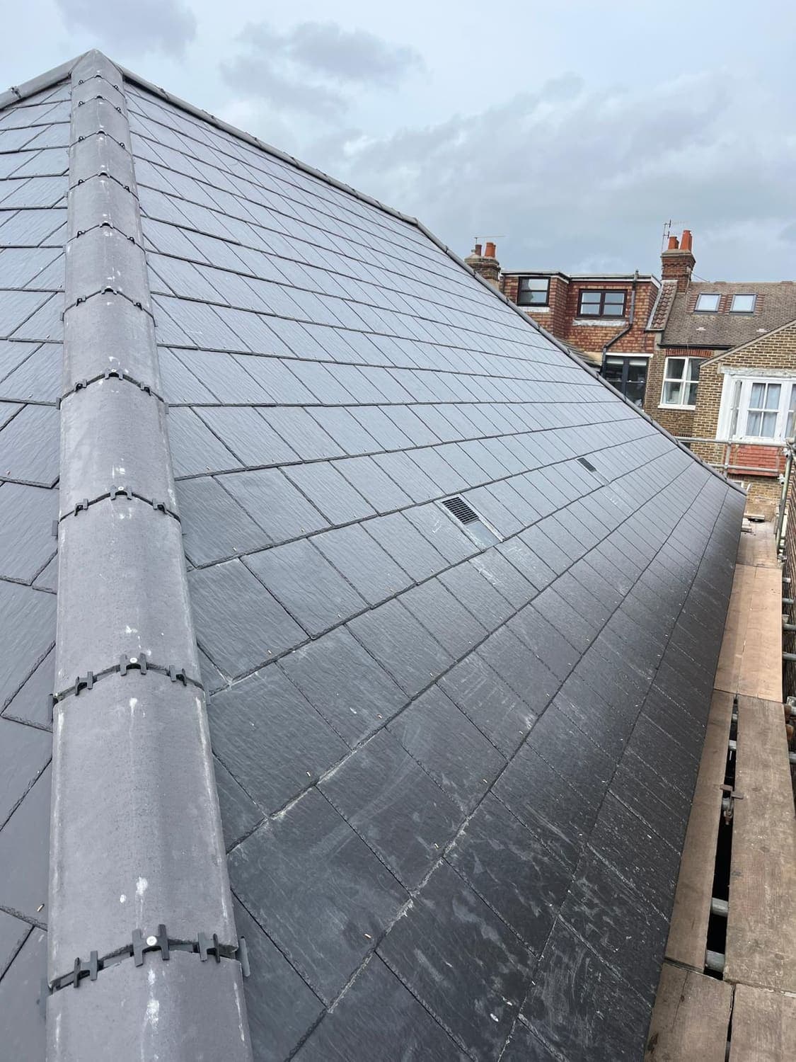Natural slate hipped roof, freshly laid